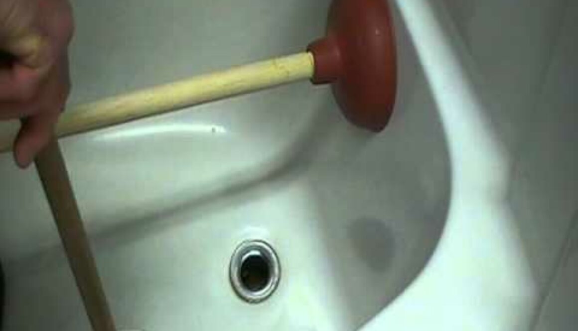 how to unblock a shower drain with a plunger