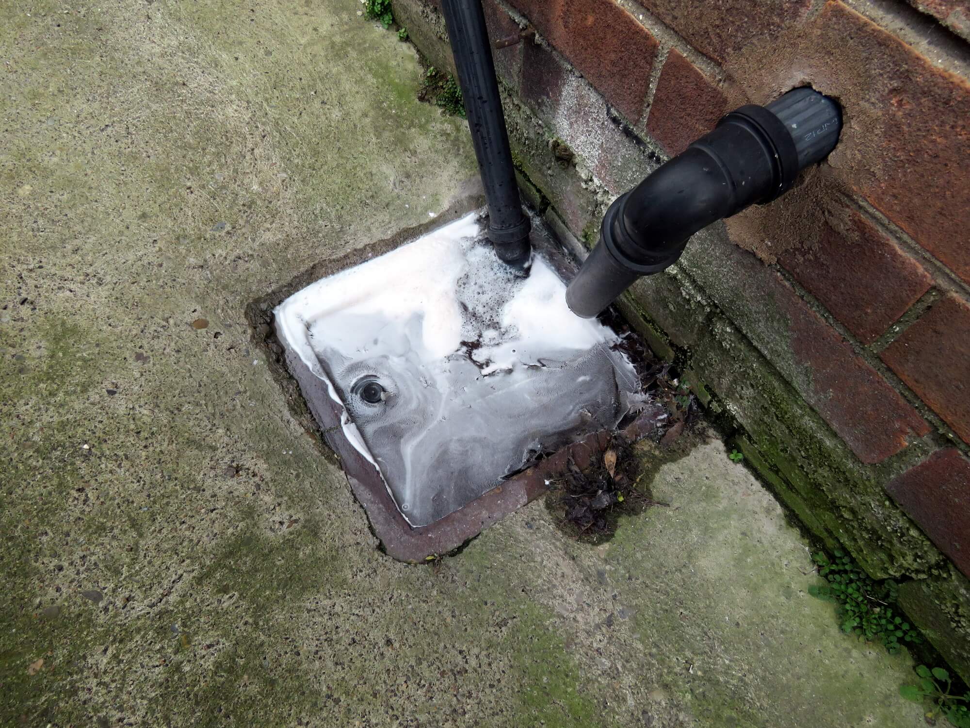 how do you unblock an outside drain