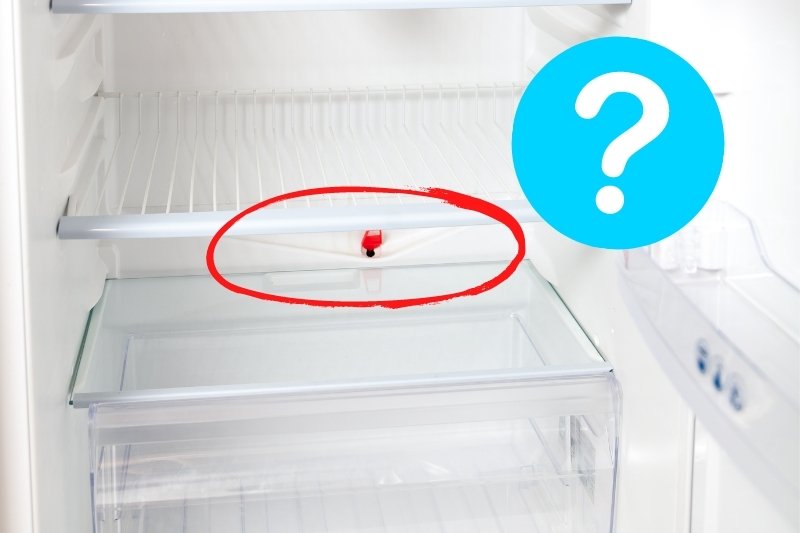 how to unblock defrost drain in fridge